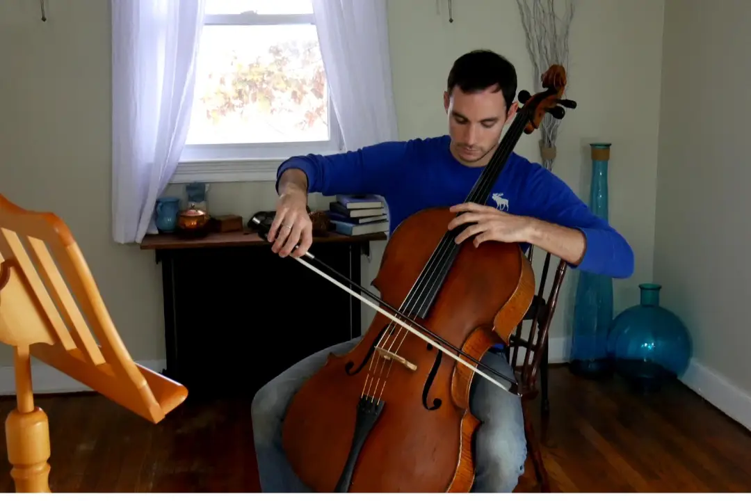 Adam practicing his cello in our music studio.