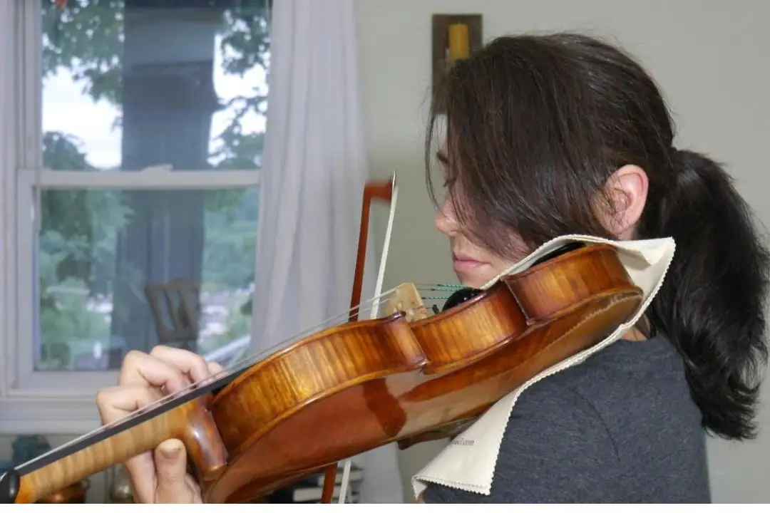 Julia practicing her violin in our music studio.